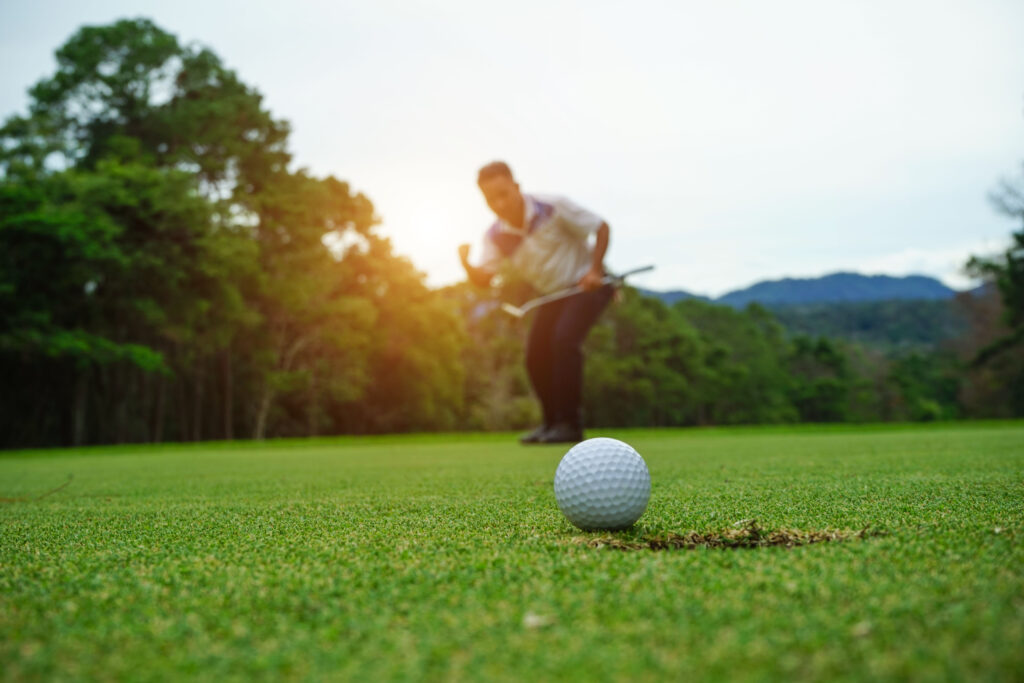 A man playing golf.