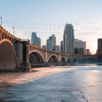 Minneapolis over a frozen Mississippi river during a Minnesota winter.
