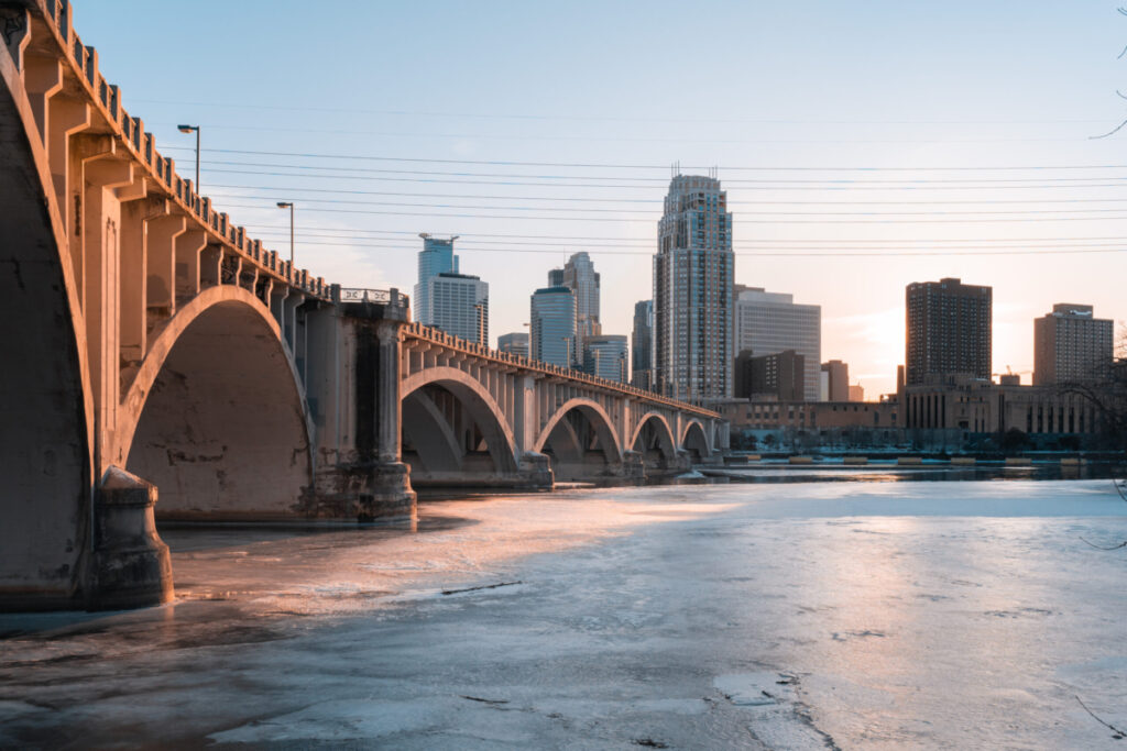 Minneapolis over a frozen Mississippi river during a Minnesota winter.