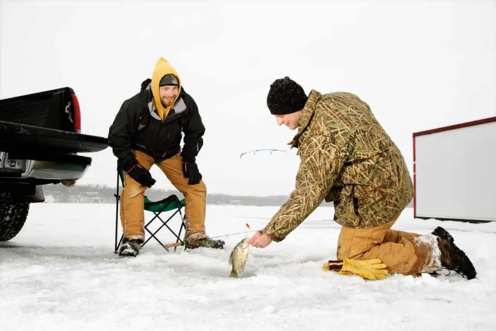 Kneeling While Ice Fishing