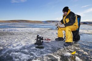 Ice fishing with a fish finder.