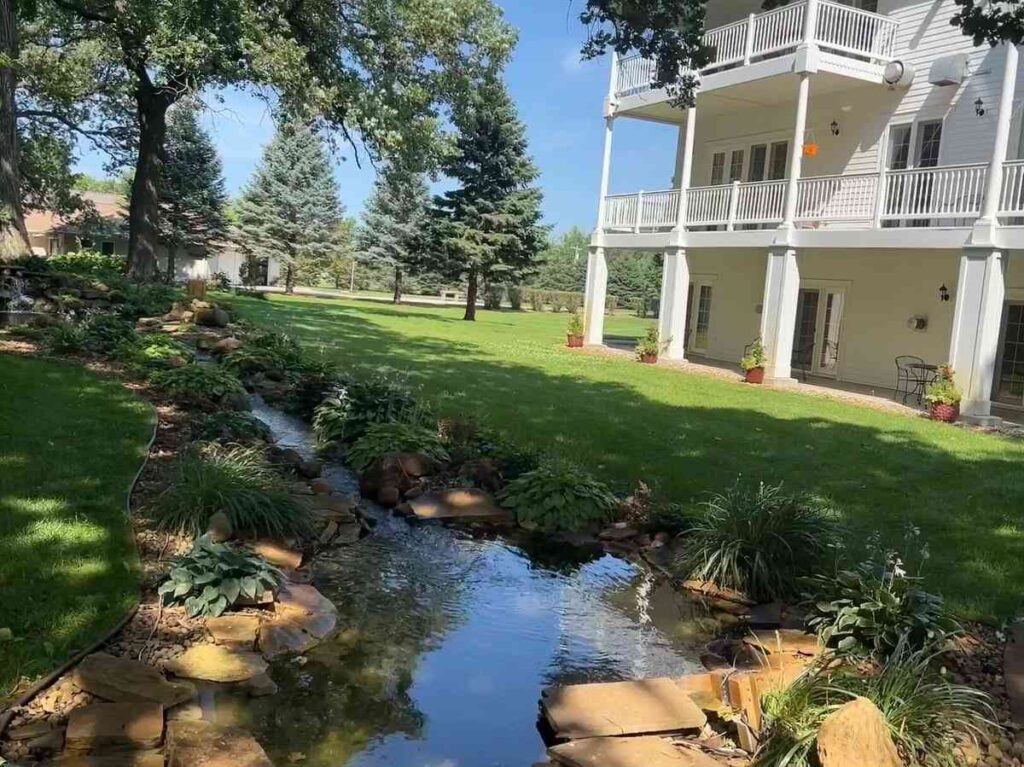 Balcony at Oakwood Inn overlooking creek and landscaping