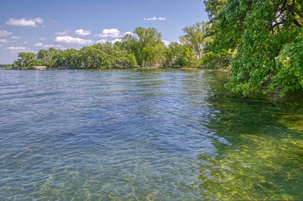 Clear water and tree lined shores at Gull Point State Park in Okoboji IA