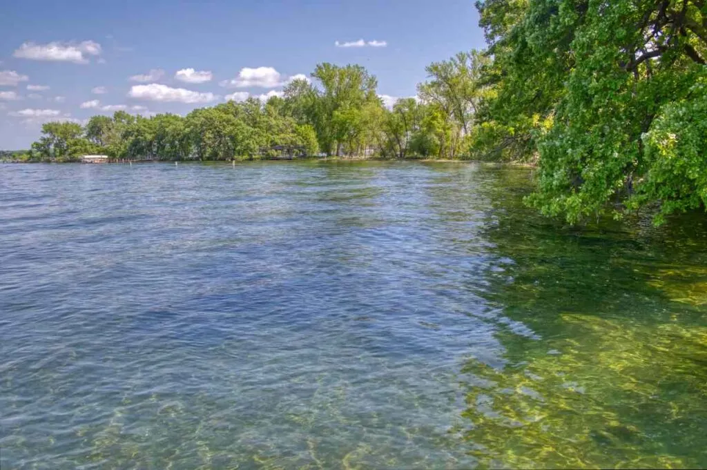 Clear water and tree lined shores at Gull Point State Park in Okoboji IA