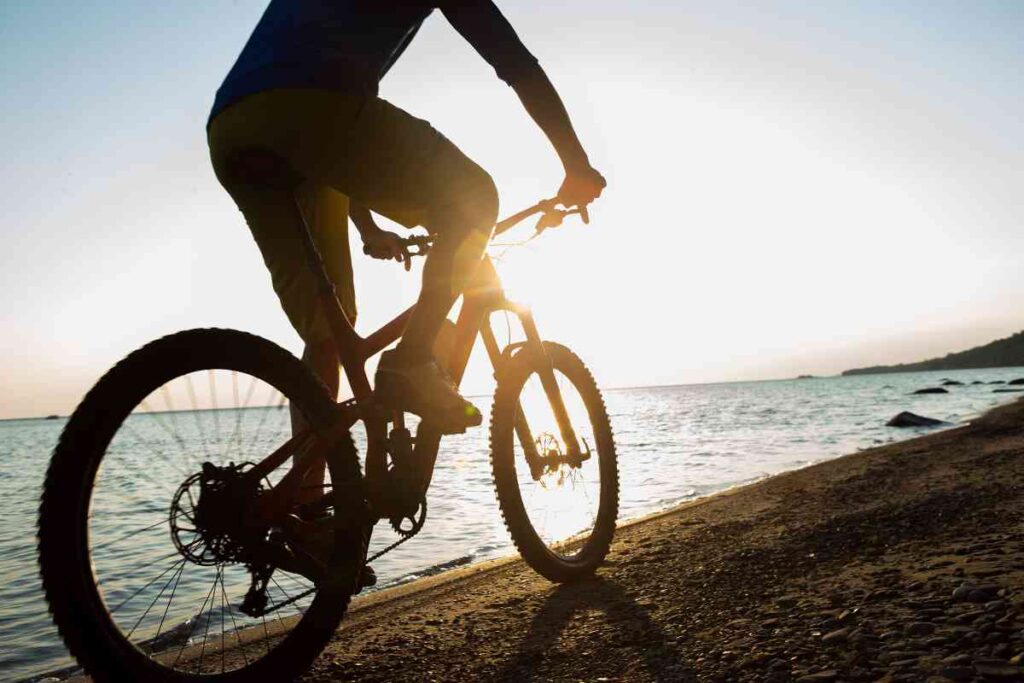 A man riding a bike along the Great Lakes 