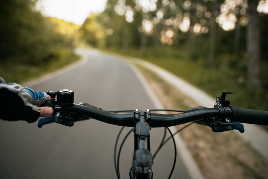 View of a bike trail from the perspective of the person riding the bike.