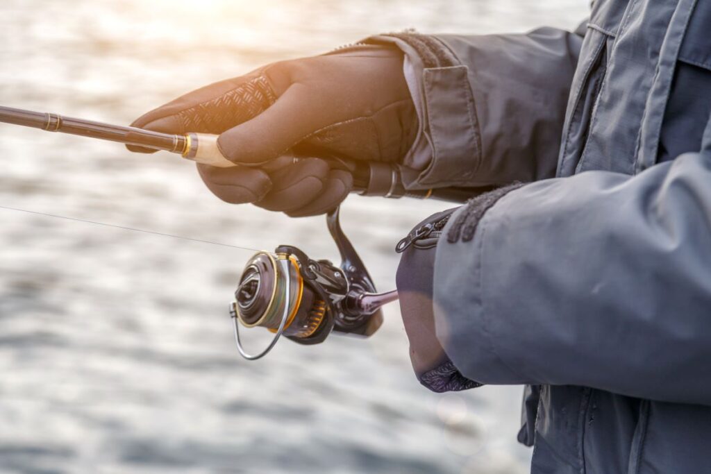 Fishing on the lake at sunset, probably using the best fishing line for bass.