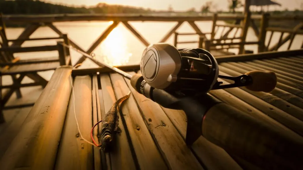 a fishing rod on a wooden table.