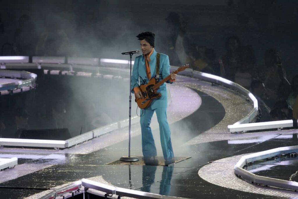 Prince performing on stage.