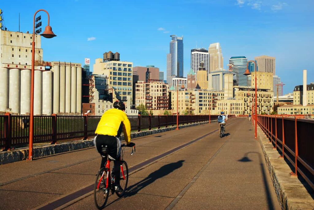 Two cyclists riding toward Minneapolis, MN. Best Minneapolis bike trails.