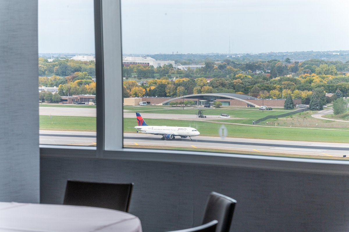 A view of a plane on a runway from one of the best hotels near Minneapolis airport: InterContinental Minneapolis Hotel.