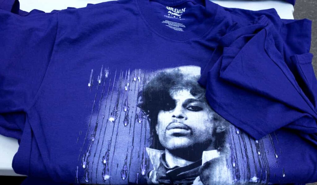 A purple t-shirt with Prince's image on the front.