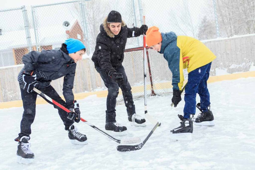 Teens Playing Hockey With Hockey Skates