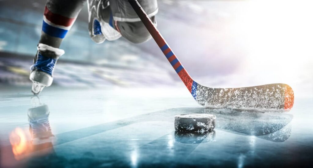 An ice hockey player in fast action on the ice.